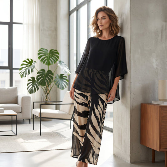 Un set elegant pentru femei, compus dintr-o bluză cu mâneci largi și vaporoase și pantaloni largi cu imprimeu😍