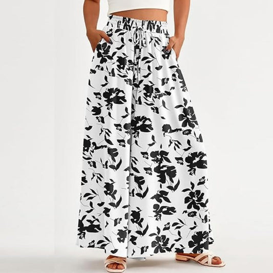 👖 30% REDUCERE ACUM! 🌸 Pantaloni cu talie înaltă și picior larg, cu imprimeu floral – ușori și fluizi – spate elastic, perfecți pentru vară sau vacanțe la resort – eleganți și comozi ✨